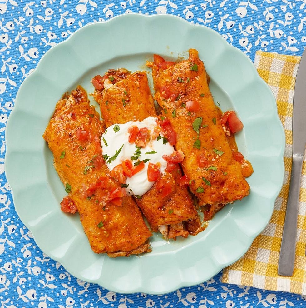 chicken enchiladas with red sauce and sour cream