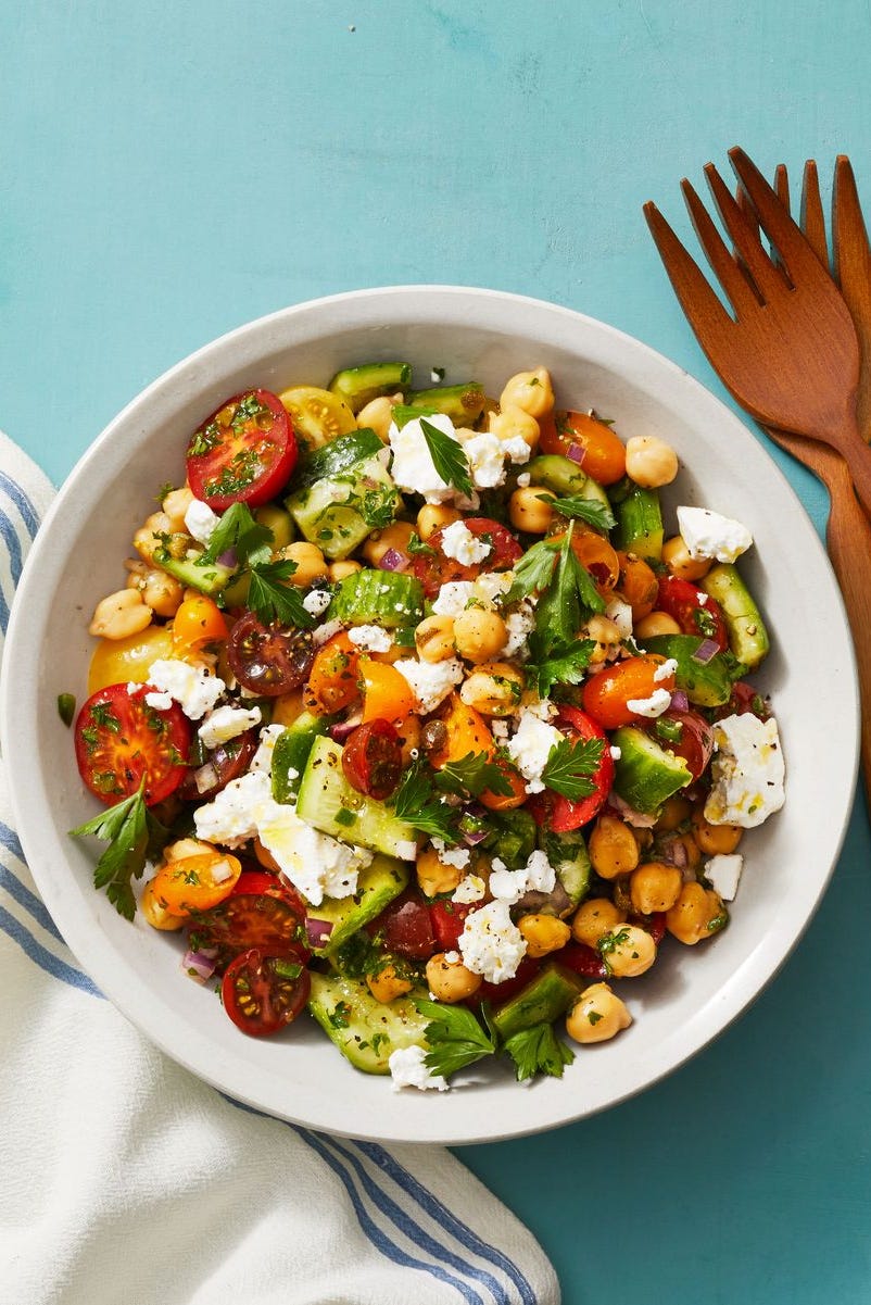 chickpea salad with smashed cucumbers in a bowl