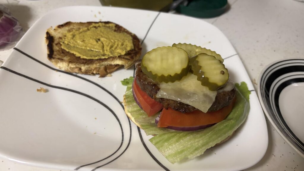 Trying a bacon and cheddar burger