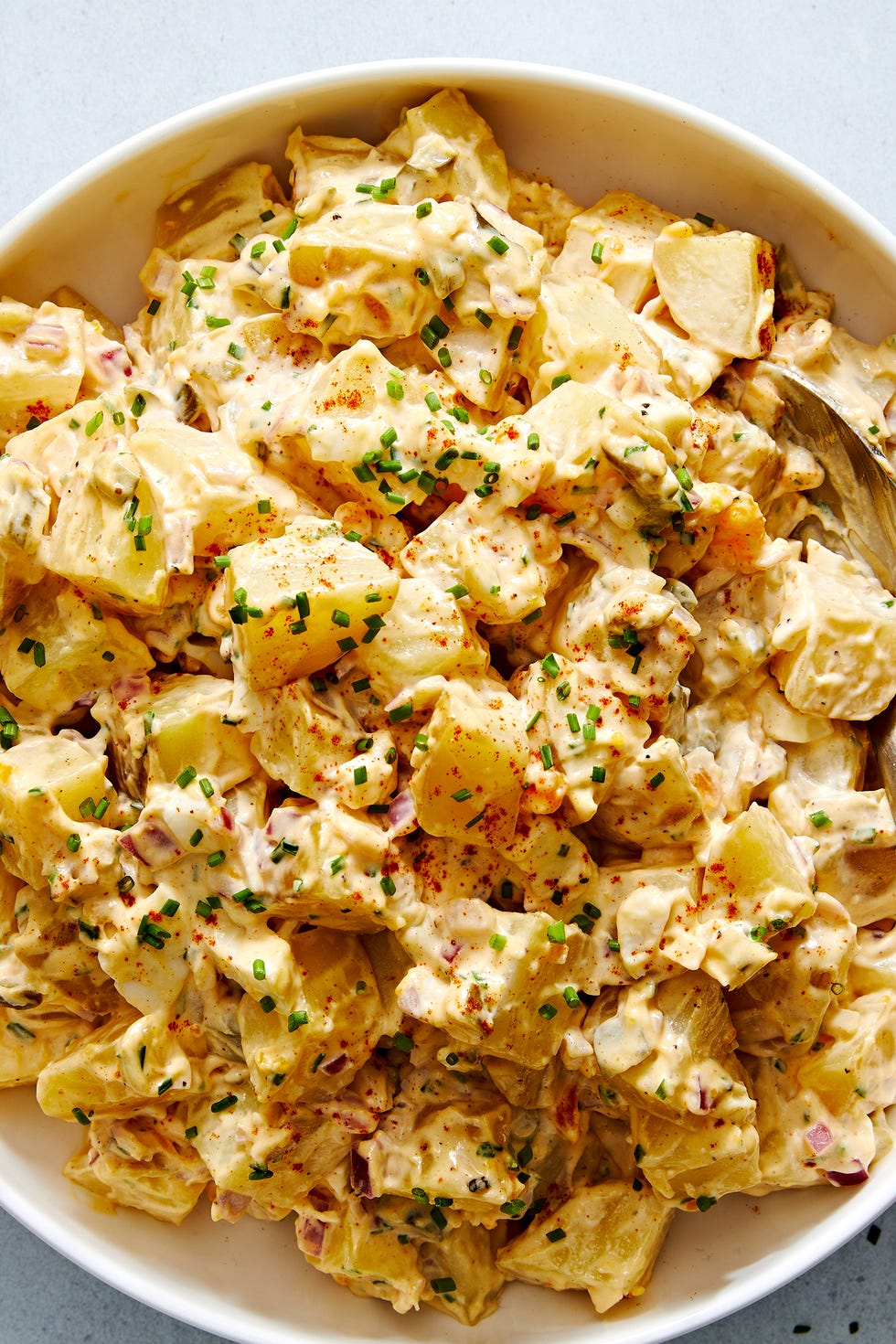 cowboy pasta salad with bowtie pasta, tomatoes, ground beef, cheese, corn, and black beans