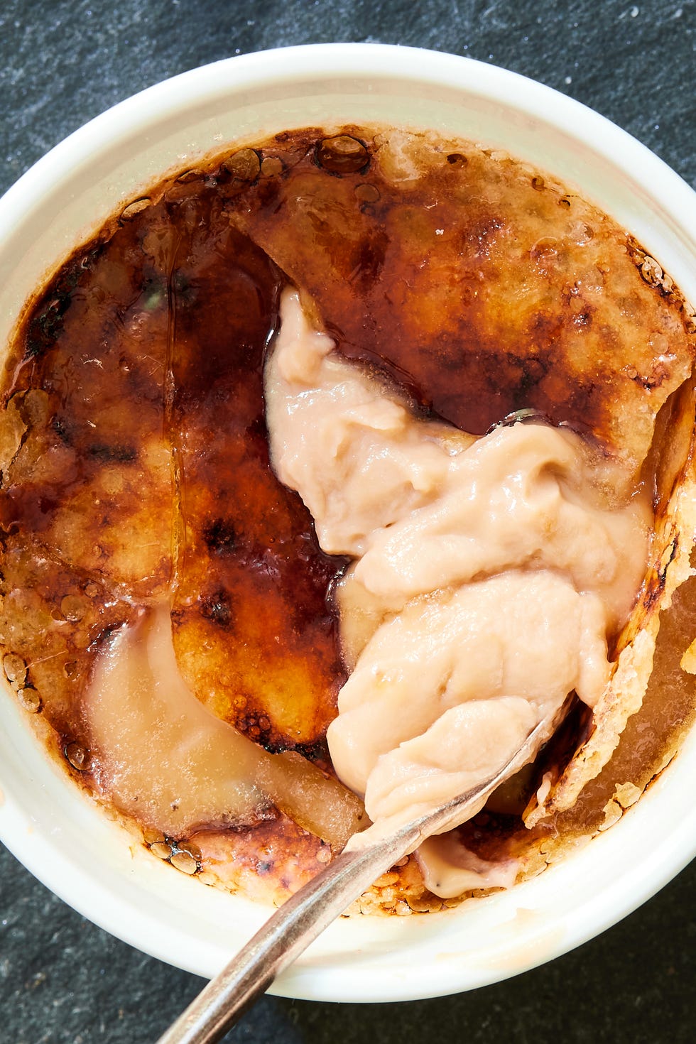 cracked creme brulee in a ramekin