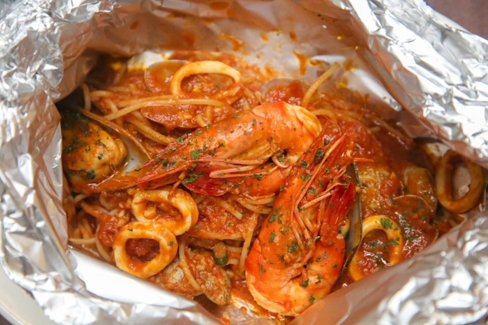 Spaghetti Alla Risata is a long standing favourite for its hearty tomato sauce studded with fresh seafood. — Picture by Choo Choy May