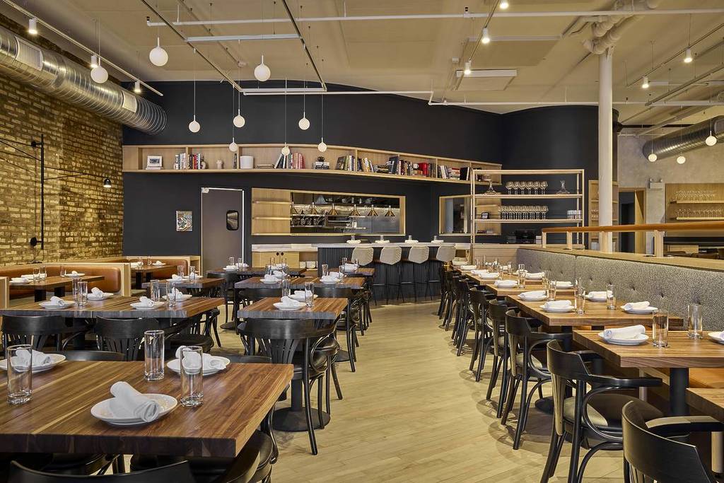 interior of daises with tables lighting and chairs