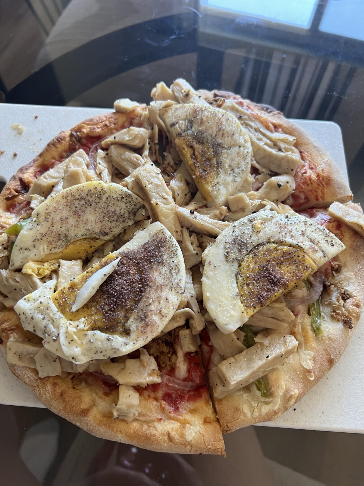 Pizza maxxing with chick’n and eggs on top