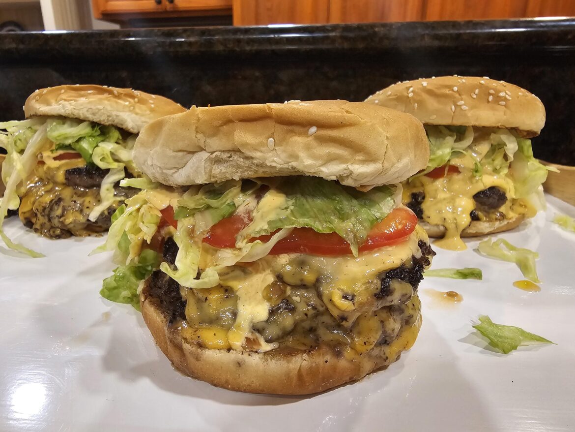 Double cheeseburgers on the flattop
