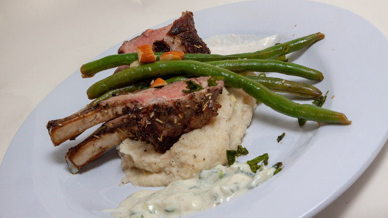 Mashed potatoes with tzatziki on a plate