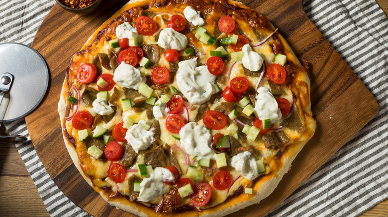 Greek-inspired pizza on a plat