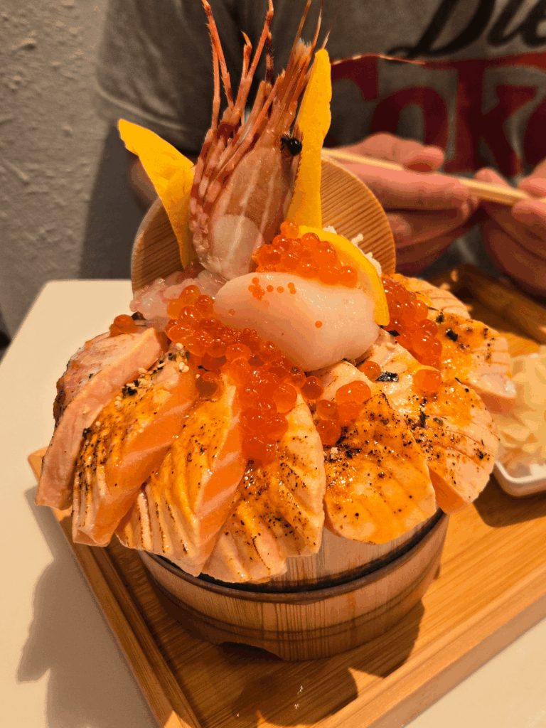 Gorgeous chirashi bowl with seared salmon, ikura, hotate, amaebi and tamago