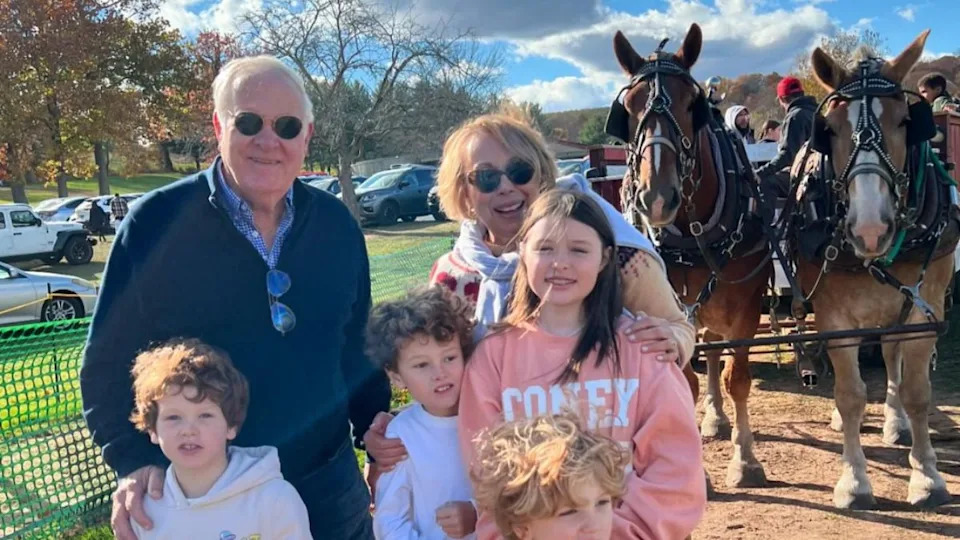 Babs Castillo and her husband with their grandkids