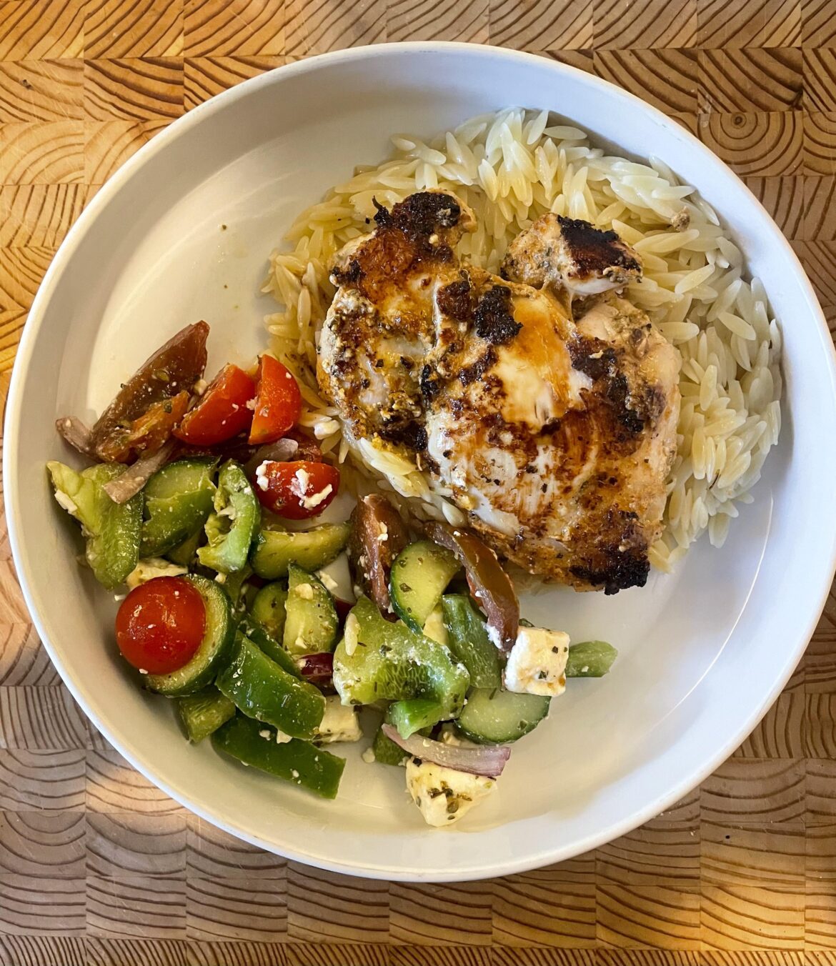 Yogurt marinated chicken, orzo and greek salad