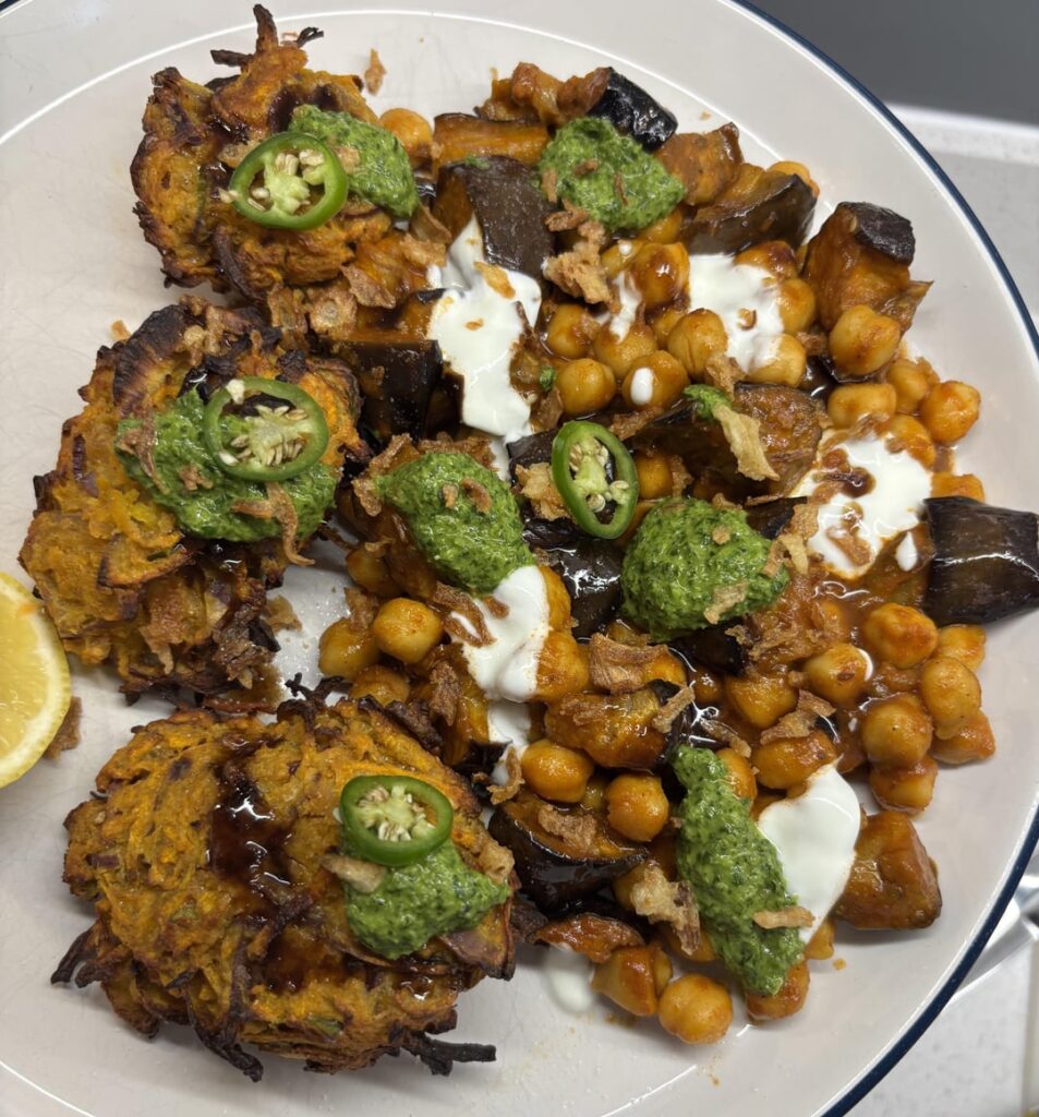 Pakora chaat with tamarind chutney and mint chutney served on channa baingan masala