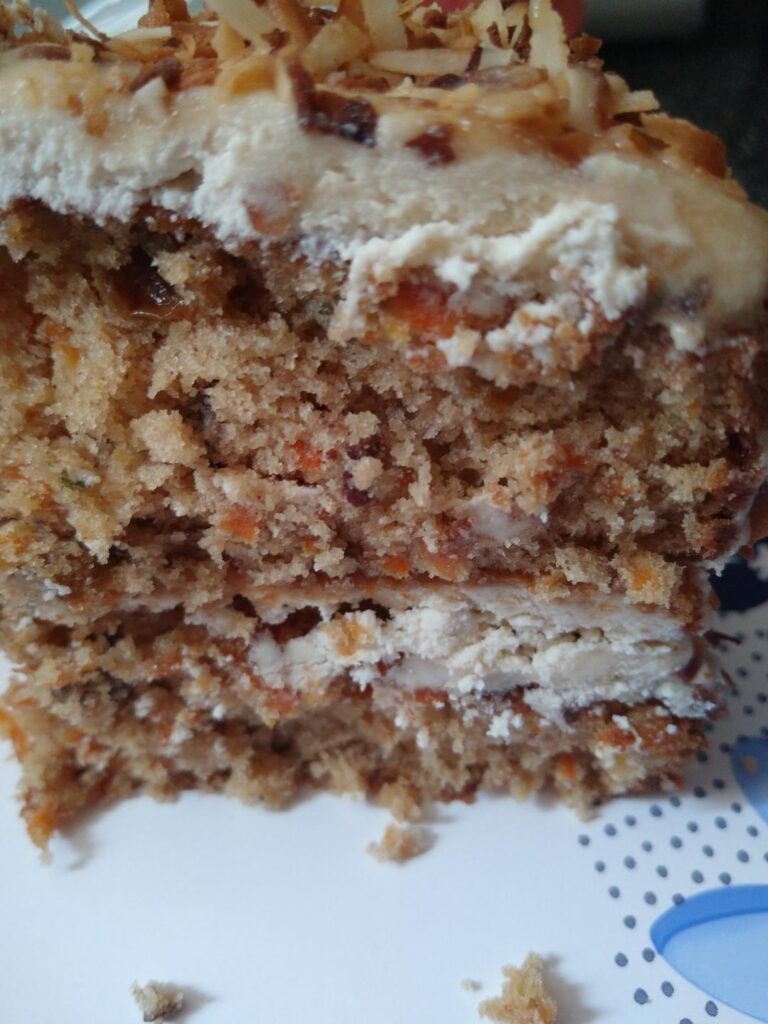 My homemade Maple Cream Cheese with Toasted Coconut flakes on top and salted caramel sauce to drizzle on top...Best Carrot Cake🥕