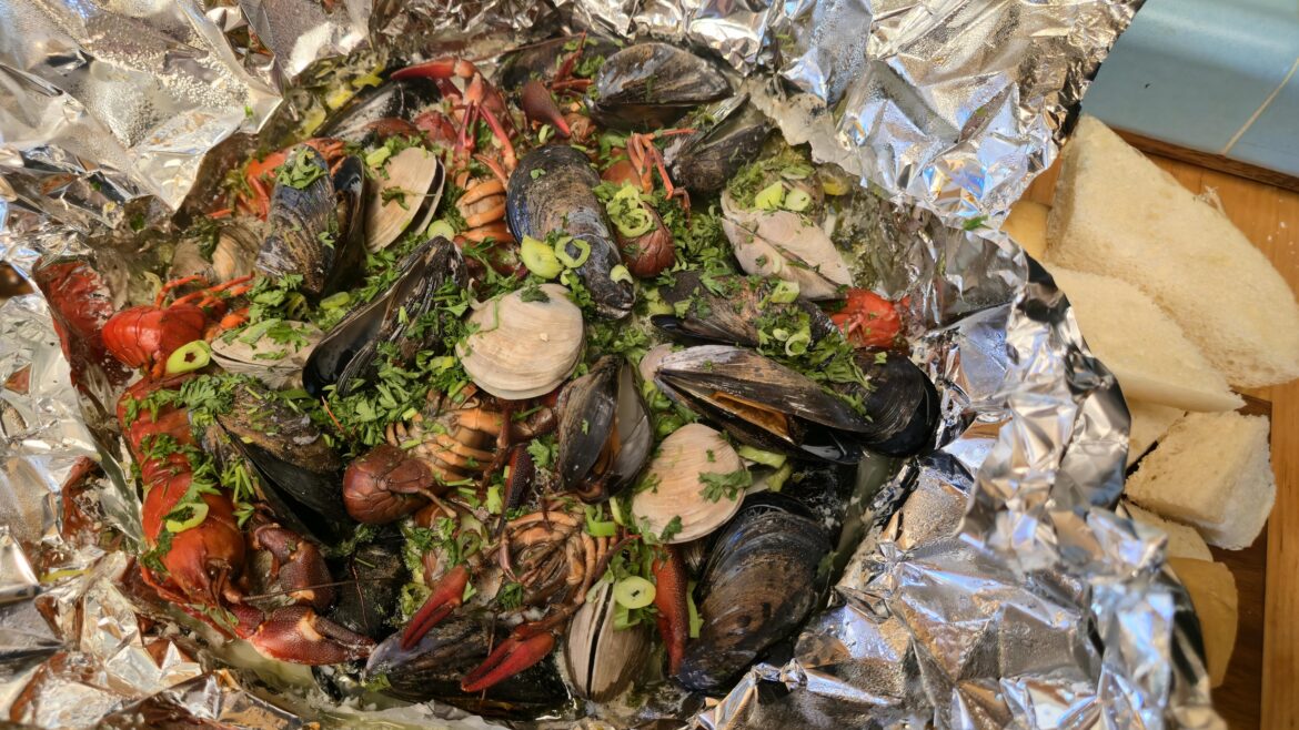 Seafood steam of mussels, clams, and crawfish in goat butter, white-wine, thyme, parsley, garlic, lemon, and scallions.