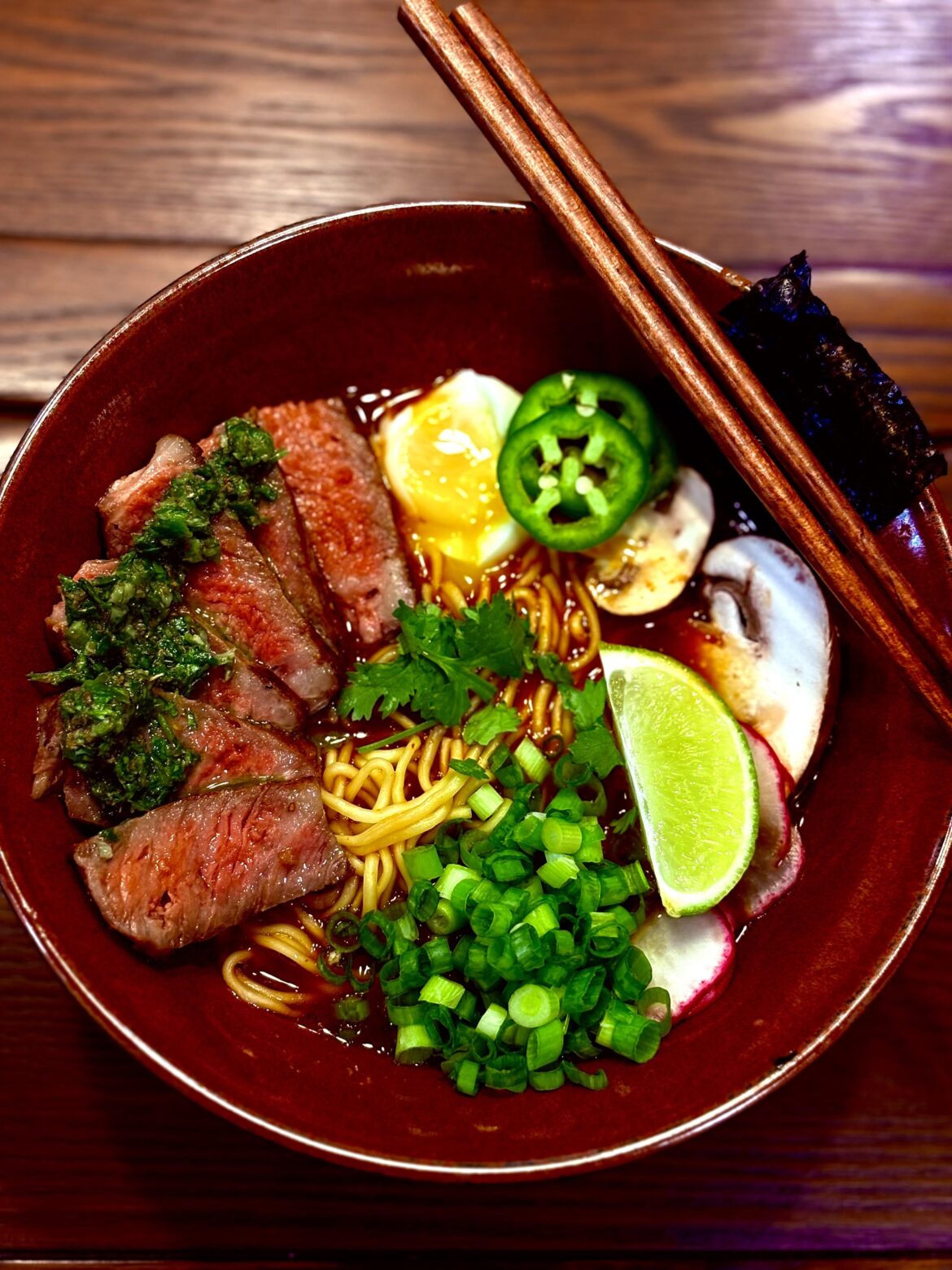 Homemade Birria ramen (pork bone/guajillo/ancho/scallion/ginger broth) and seared steak with chimichurri
