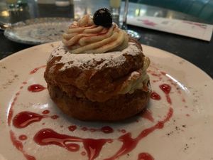 The delectable Zeppola: a soft choux bun with vanilla cream and amarena cherries.