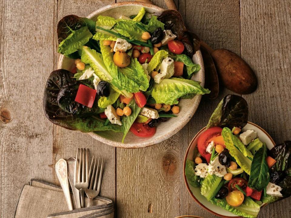  With its plump tomatoes, bell pepper, romaine, chickpeas and feta, summer Greek-style salad will transport you to the Aegean.