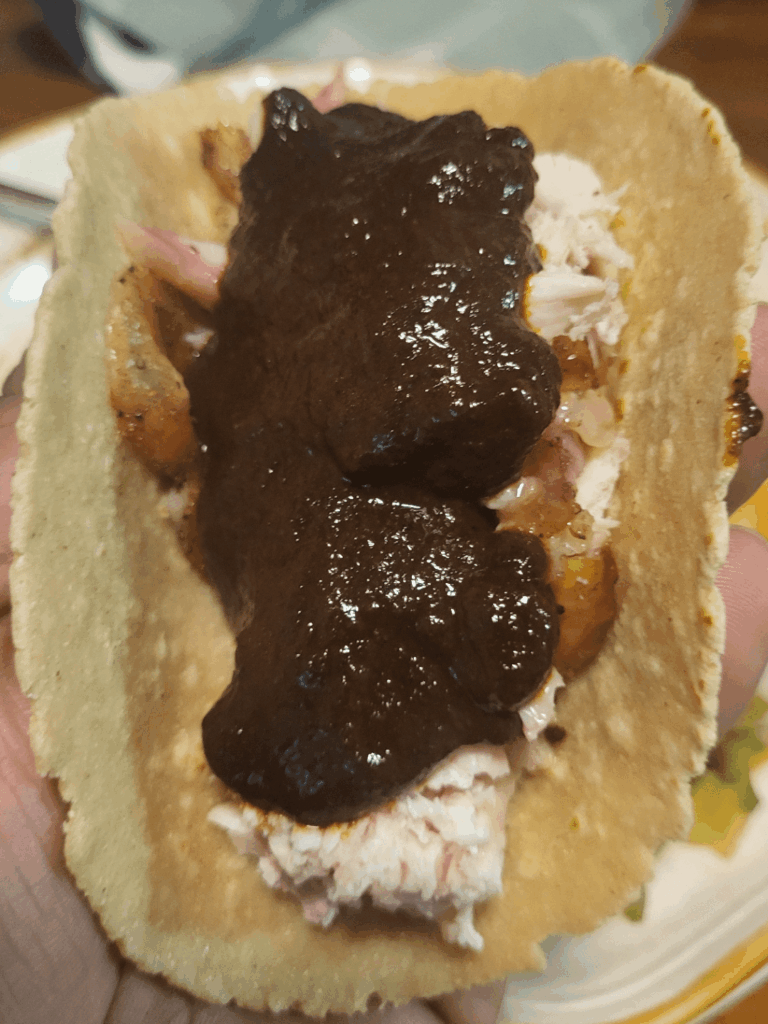 Tacos de Mole Negro con Gallina.