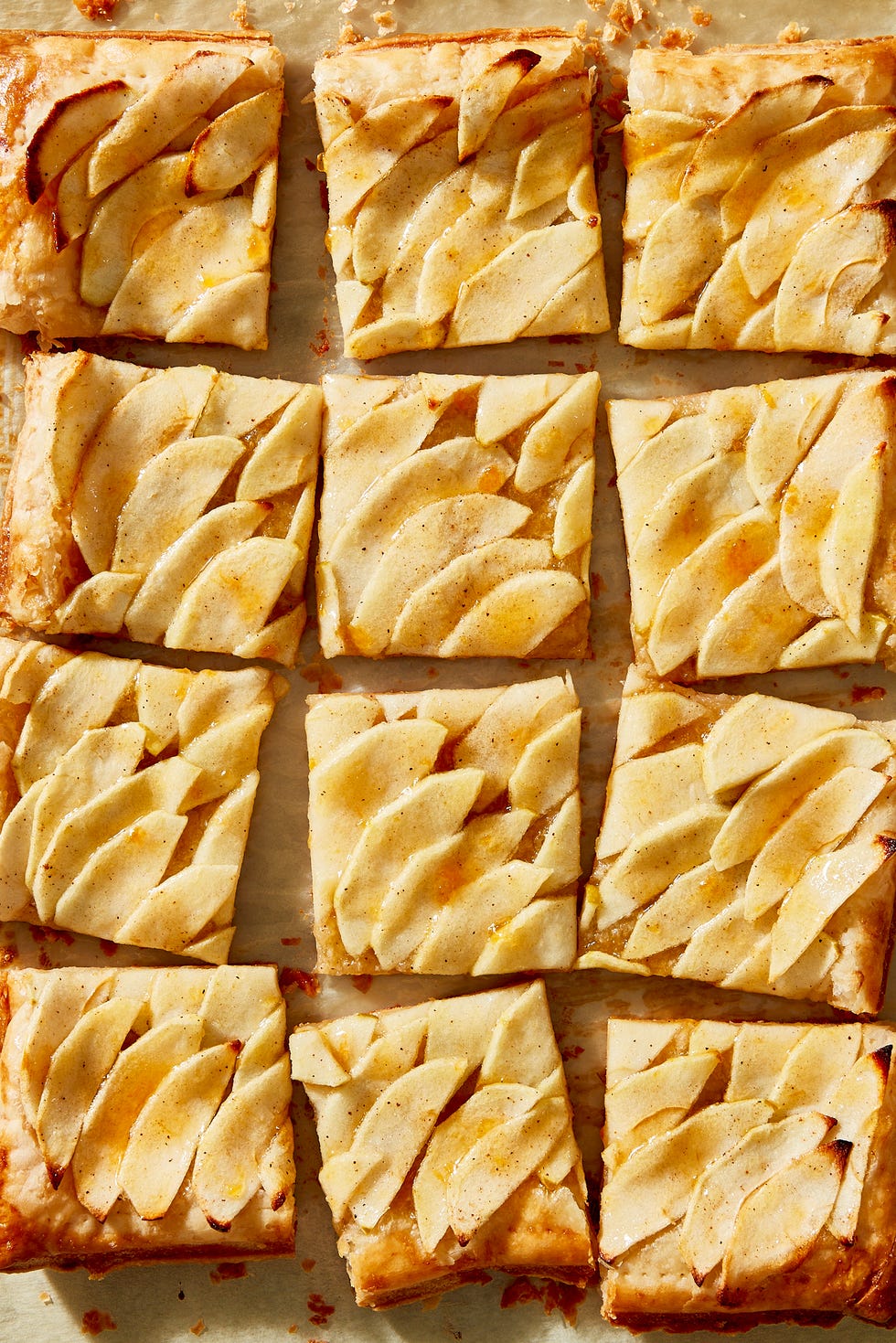 french apple puff pastry tart cut into 9 squares