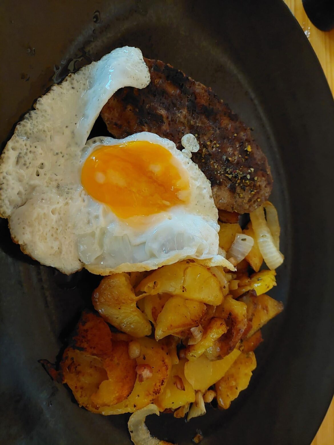 Beef meat ball, fried potatoes and fried egg [OC]