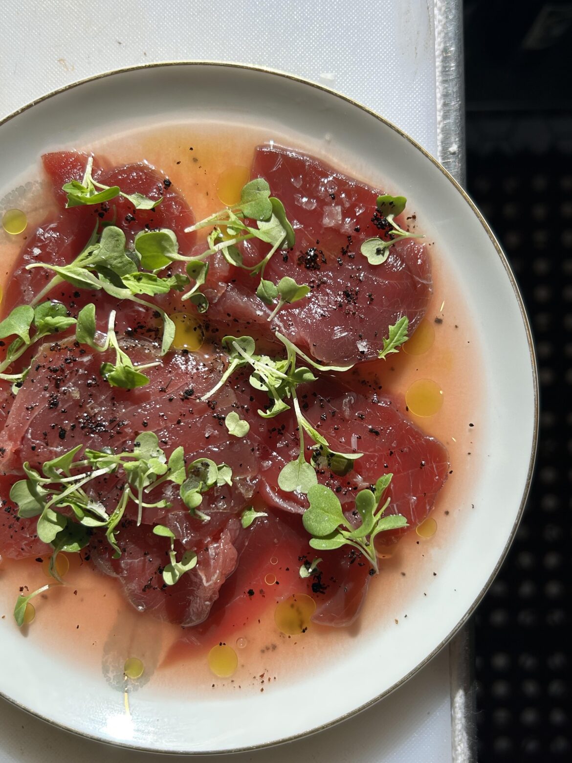 San Diego Blue Fin, tomato water, cilantro oil, Urfa Biber, micro mizuna