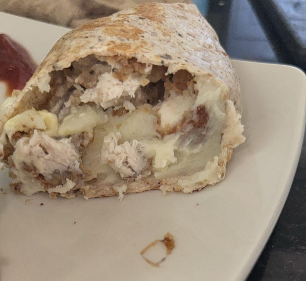 Fish, mash, and cheese. In a wrap. Ketchup to dip. Have at.