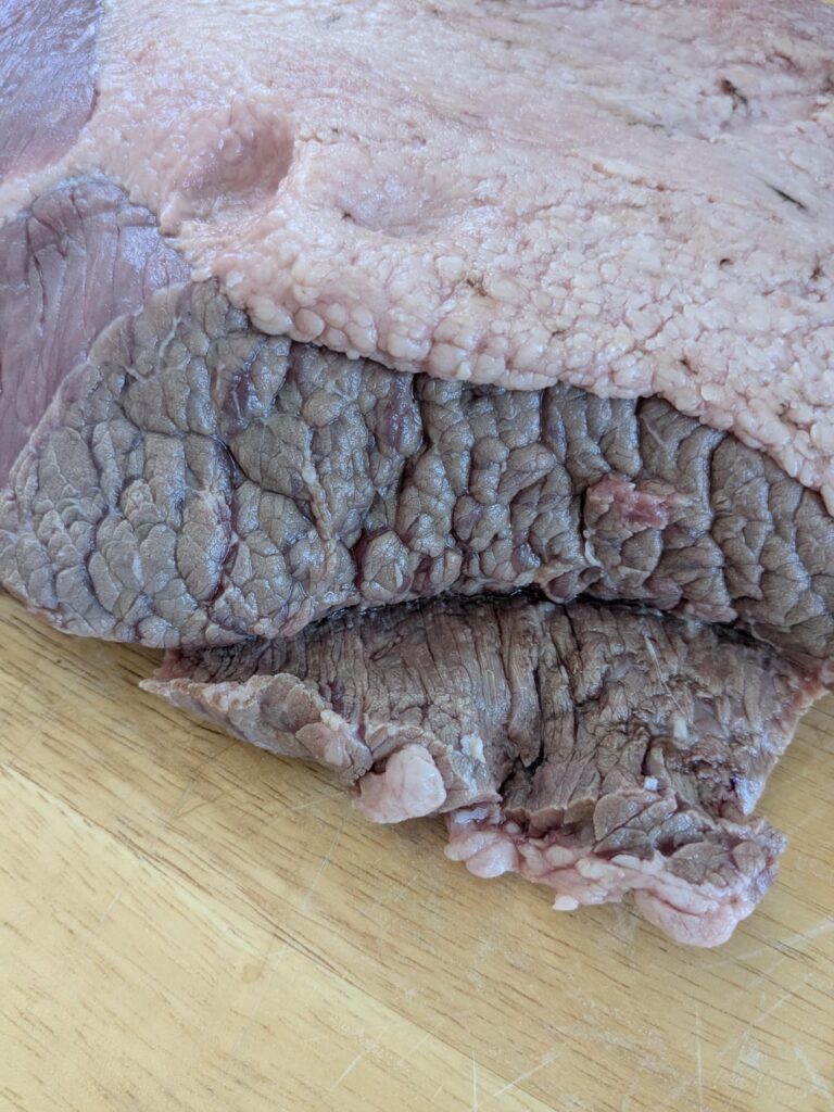 What's going on here? Just purchased, sell by date is 7/13. Gonna cut it off, no smell?