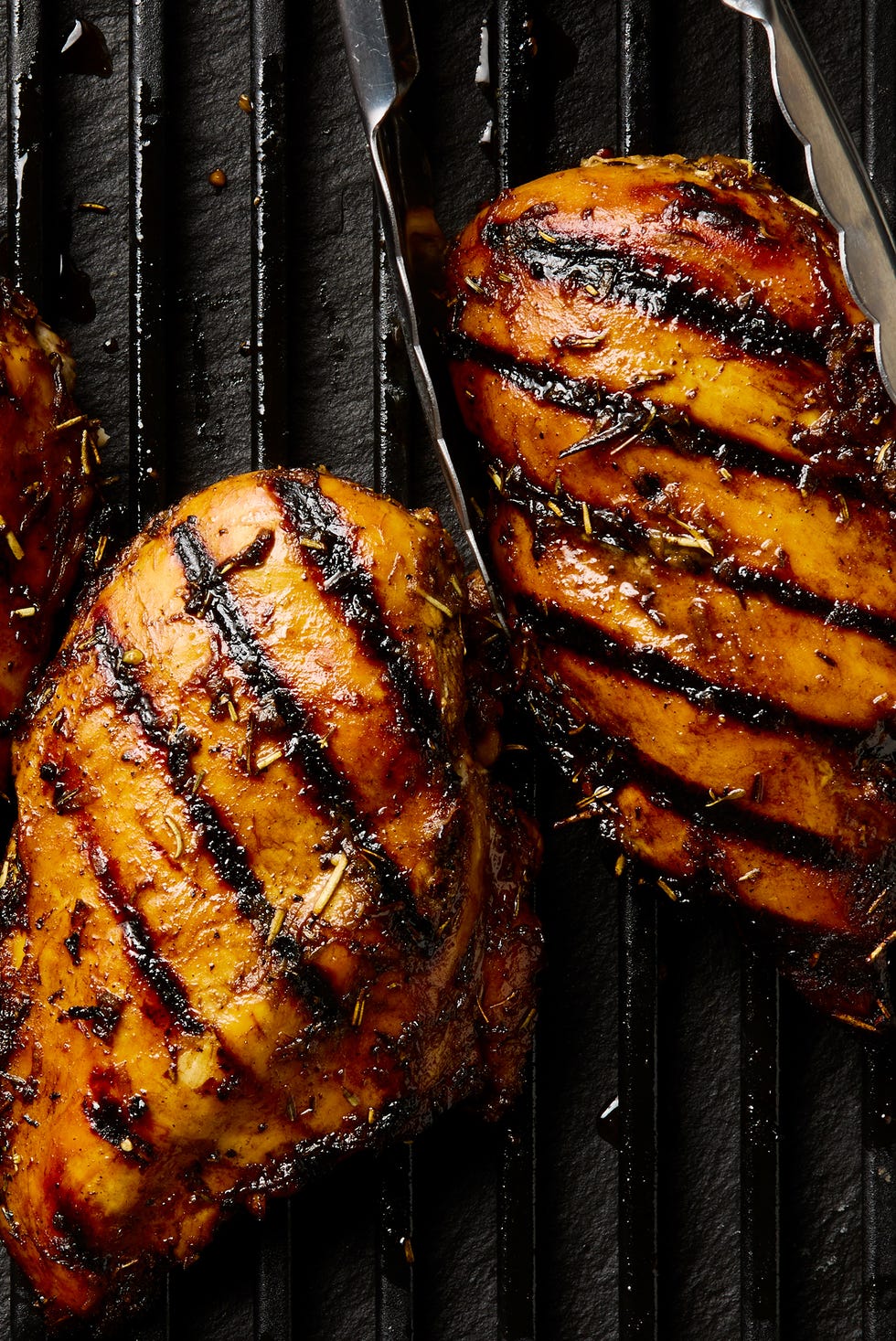 grilled chicken breasts topped with herbs