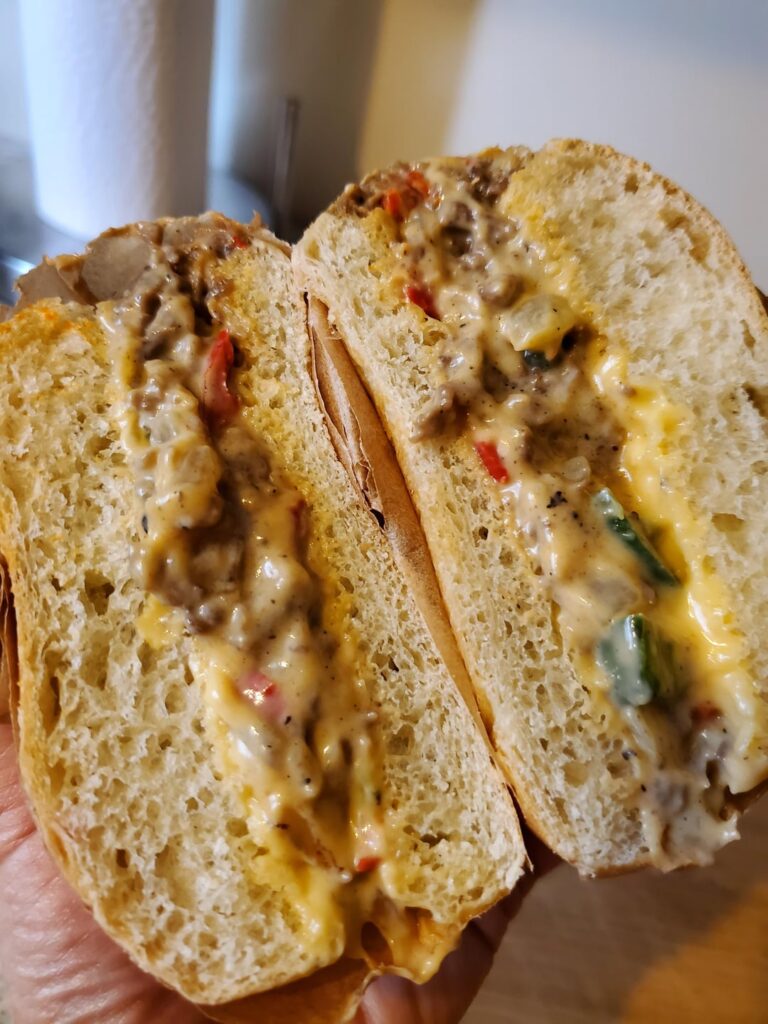 Had enough sliced ribeye left to make a small version of chopped cheesesteak with onions, sweet peppers, and jalapeños on a soft roll.