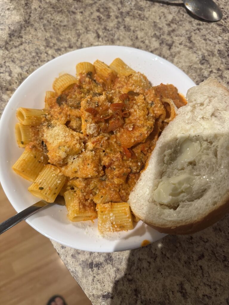 Spooky Chicken Riggies. 3 crushed pickled Ghosts in a small pot of riggie sauce. 1 for the garnish.