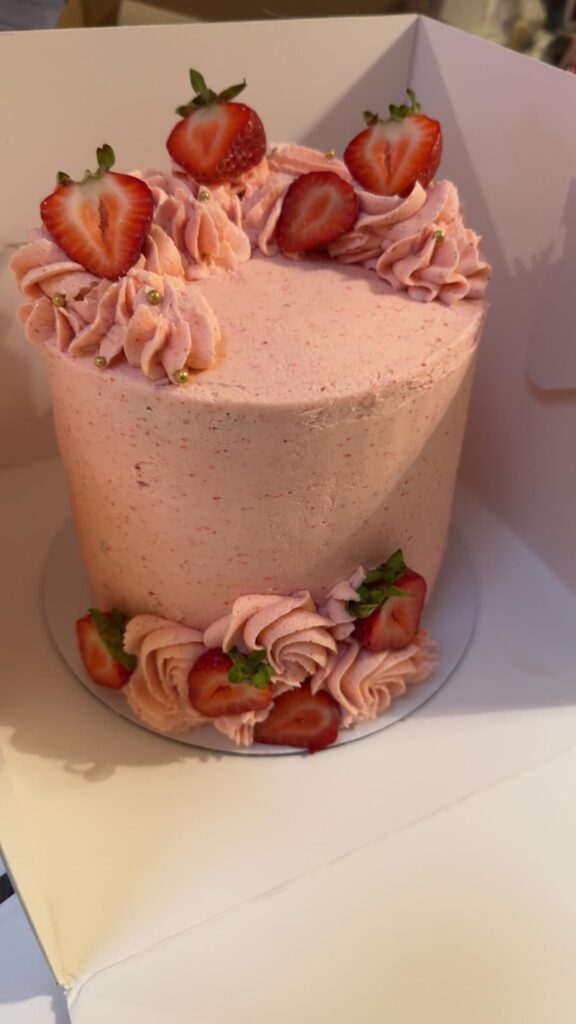 I made a homemade strawberry cake with strawberry frosting (swipe to see cross section)