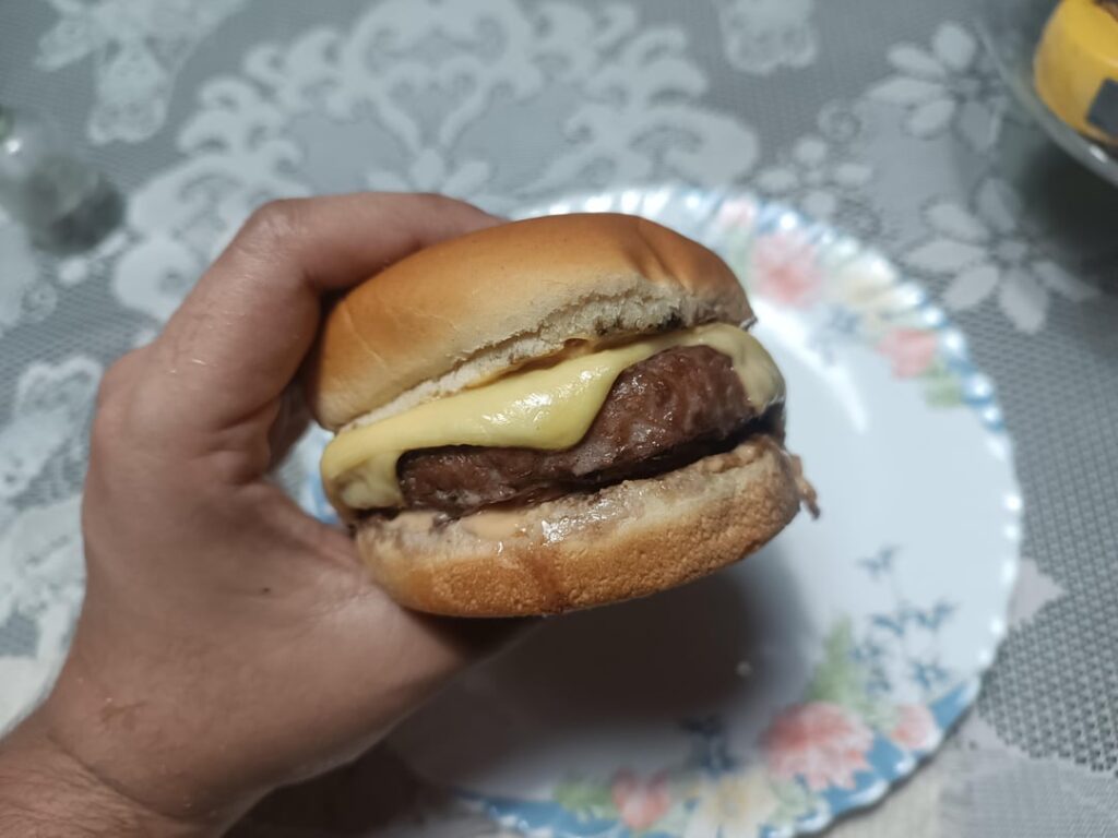 Simple cheeseburger cooked on the grill