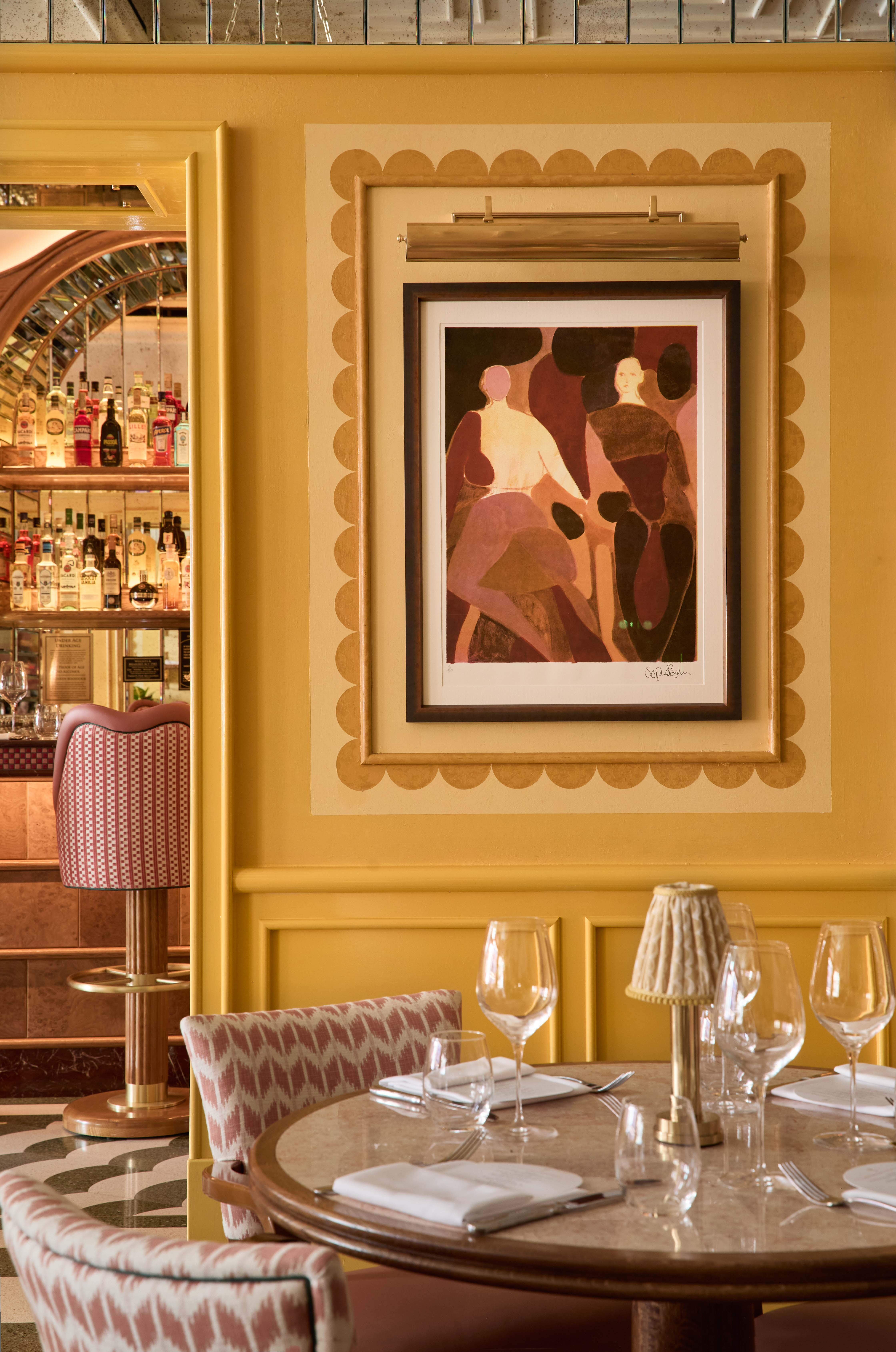 An abstract artwork on a yellow wall, framed in mustard scallops