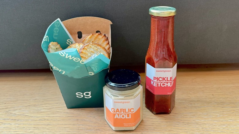sweetgreen ripple fries, garlic aioli sauce, and pickle ketchup on display