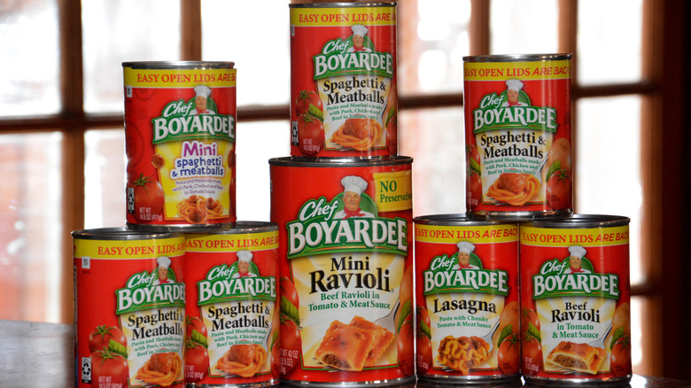 A stack of different Chef Boyardee canned pasta meals