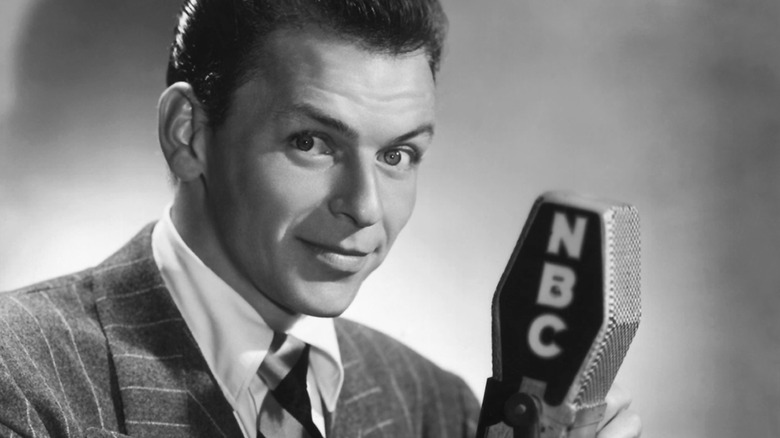 Frank Sinatra posing with an NBC microphone