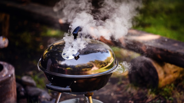 A closed grill outside during the day.