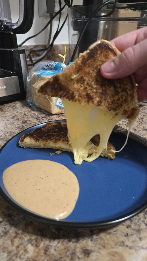 Cast iron, white bread, butter, 2 American cheese, one Swiss cheese, mock Cane's sauce