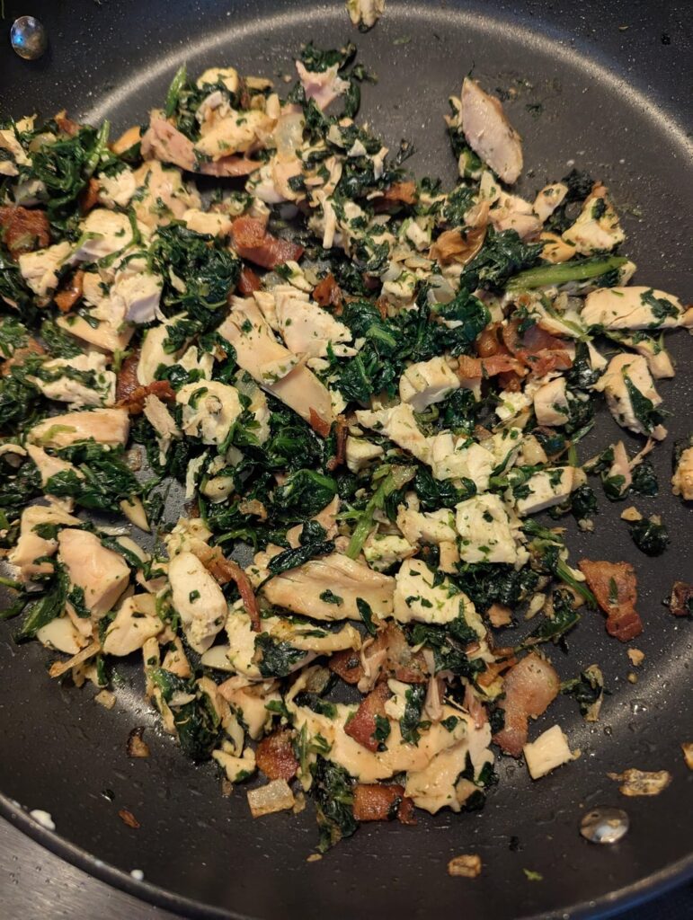 I rolled out a sheet of pasta, cut into 5 rectangles, and rolled them up like burritos filled with chicken, bacon, spinach, feta, garlic, and pecorino. Topped with an Alfredo sauce and baked.