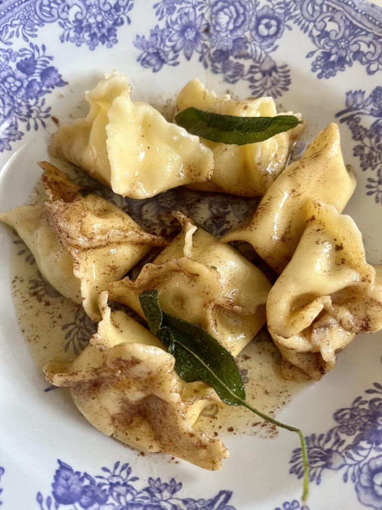 Fagottini filled with ricotta, Parmigiano, spinach and a pinch of nutmeg. Sauce is just browned butter + sage