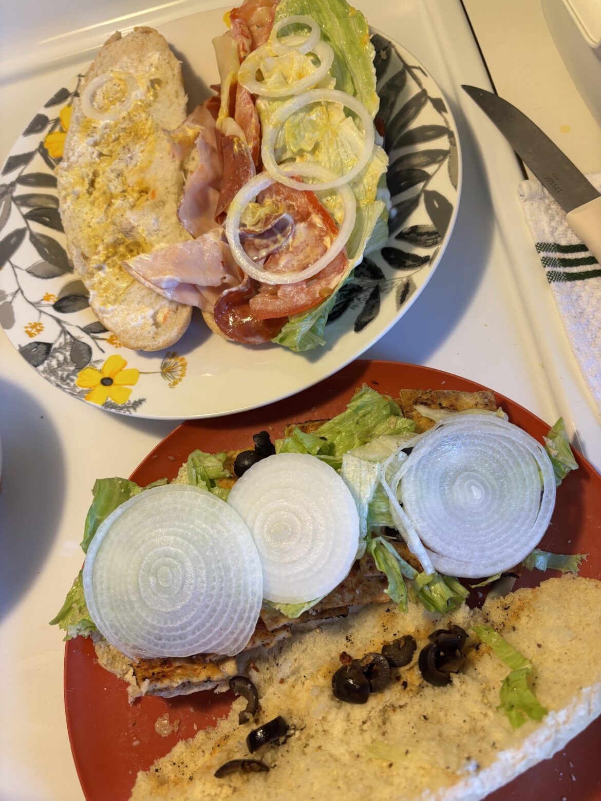 My sandwich vs my husband’s. This was fresh out of the ground that day, so I had to do the full slices on mine🤤