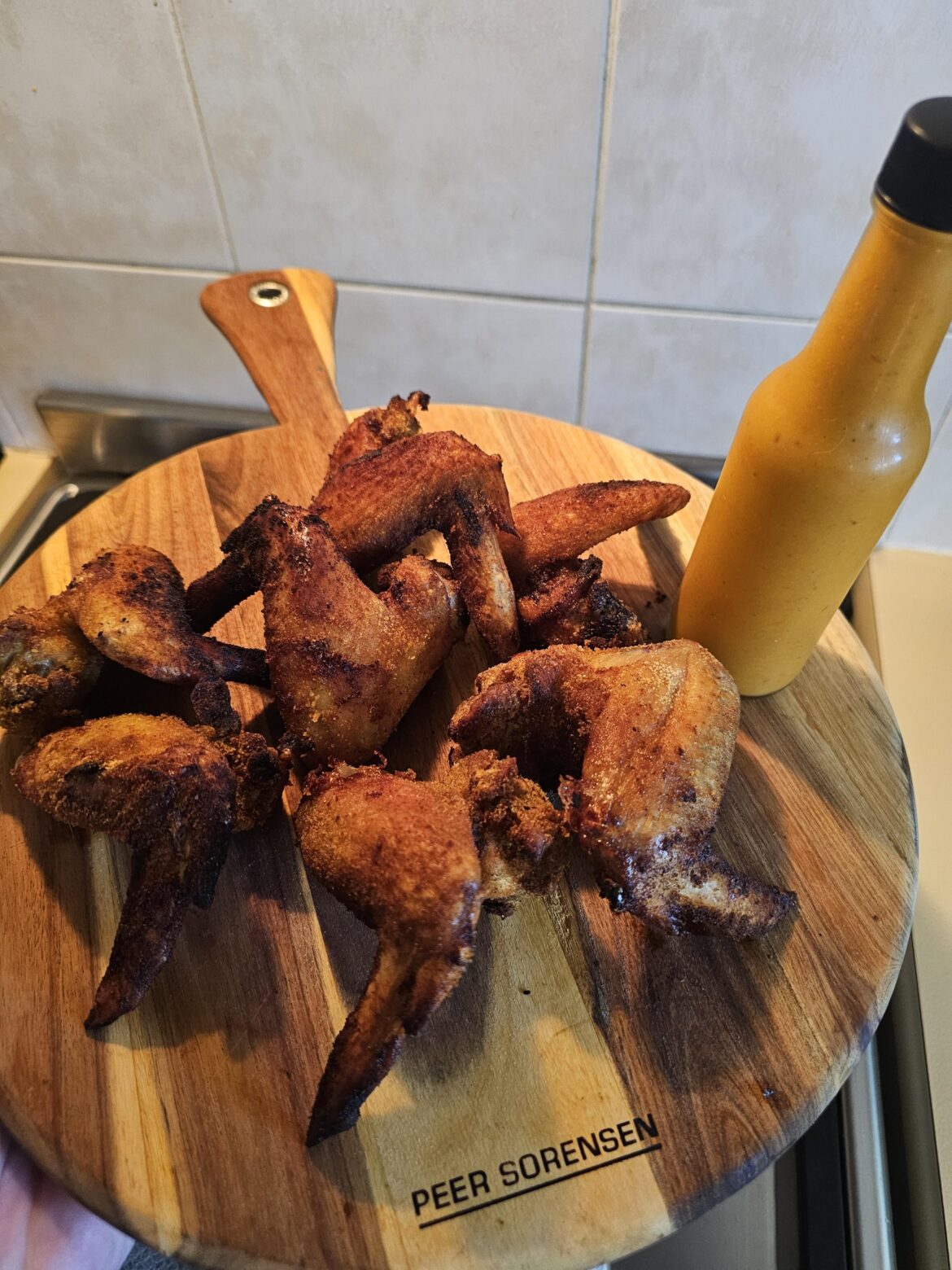 Homemade wings and my own homemade hot sauce.