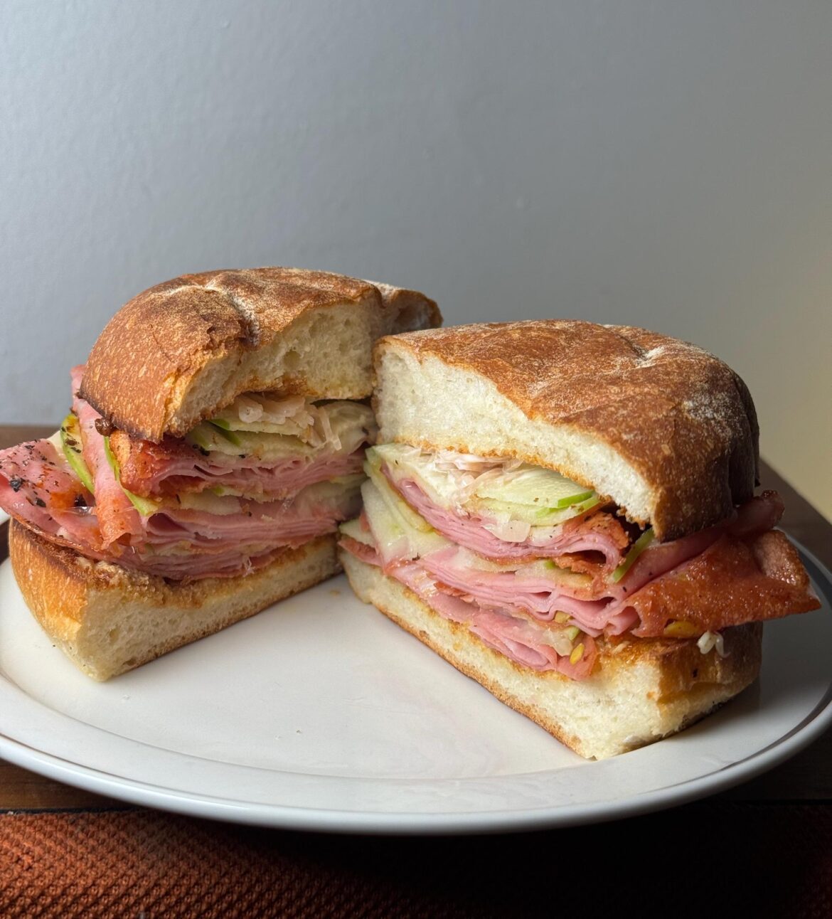 Pan fried ham, Swiss, thin-sliced Granny Smith apples, pickled shallots, Dijon, Kewpie.