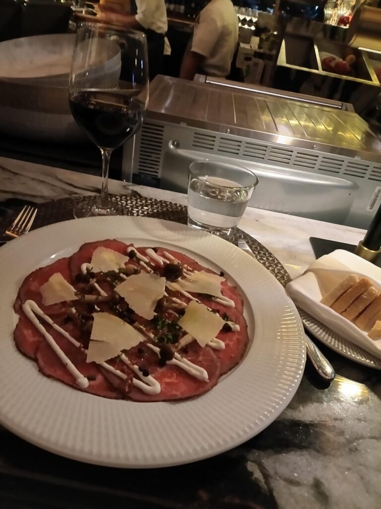 Black and Blue, 130 King West. Just a wine and carpaccio. Pricey but very delicious.