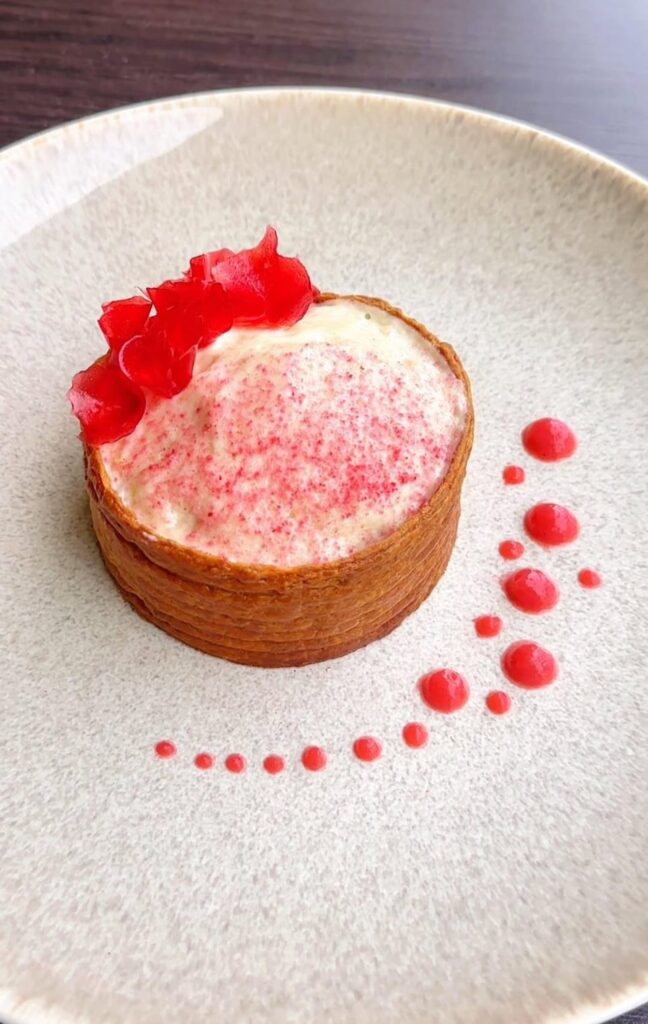 Puff pastry ring, lemon verbena yogurt espuma, strawberry paper, strawberry fluid gel, etc.