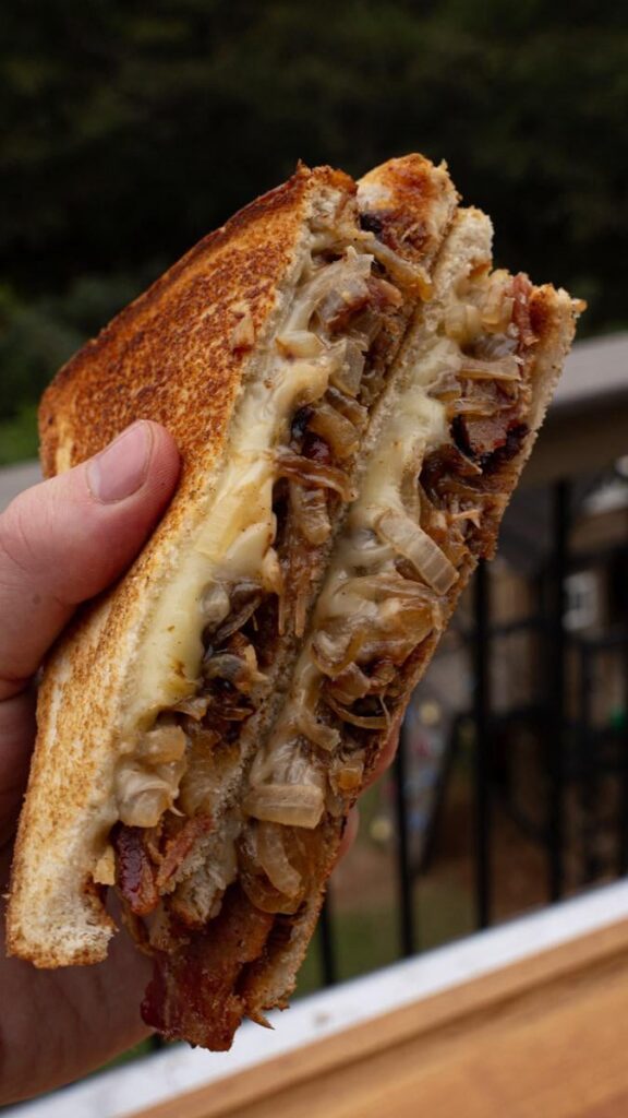 Cheesy Pulled pork sandwiches with bacon for good measure. The bacon grease makes for one hell of a sandwich crust. Anyone else do this regularly?