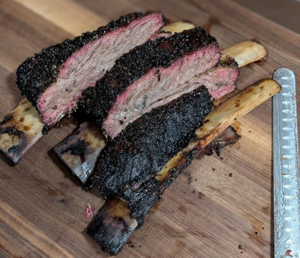 Plate ribs today .. weber kettle, JD + oak chunks