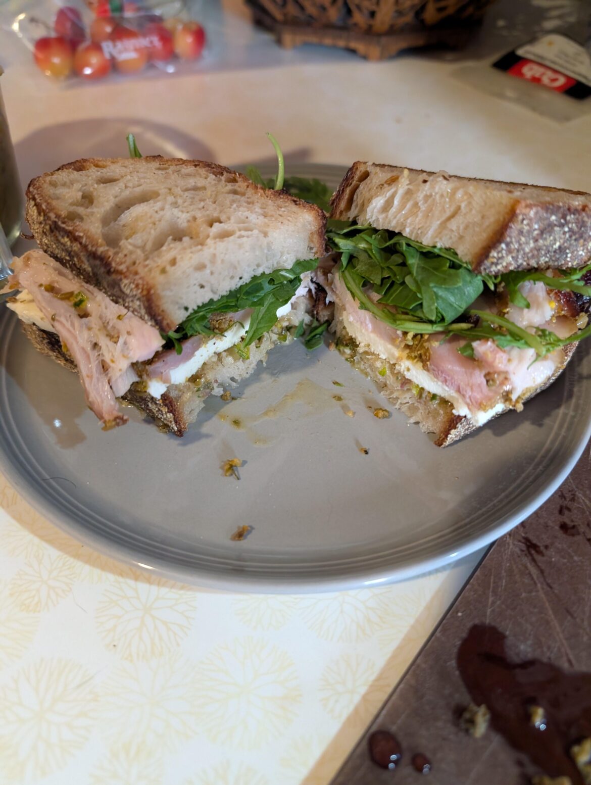 Porchetta with salsa Verde, mozzarella, arugula on sourdough