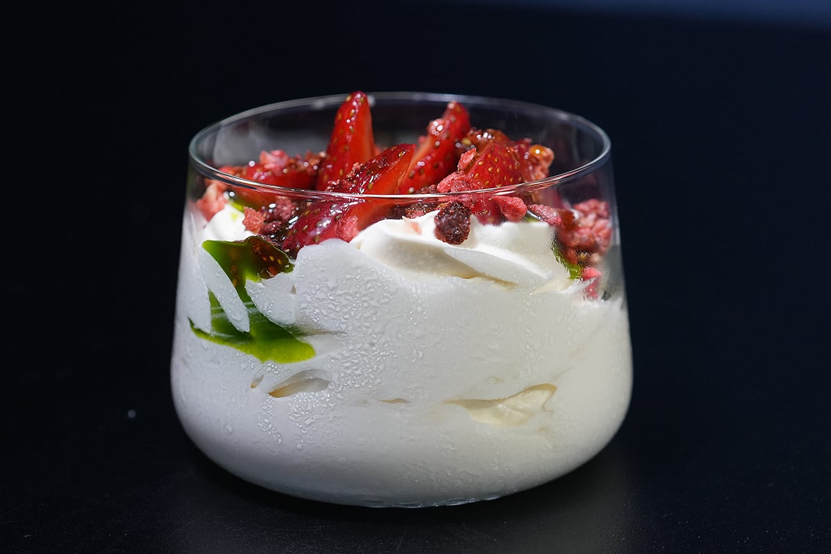 Soft Serve and strawberries in glass cup