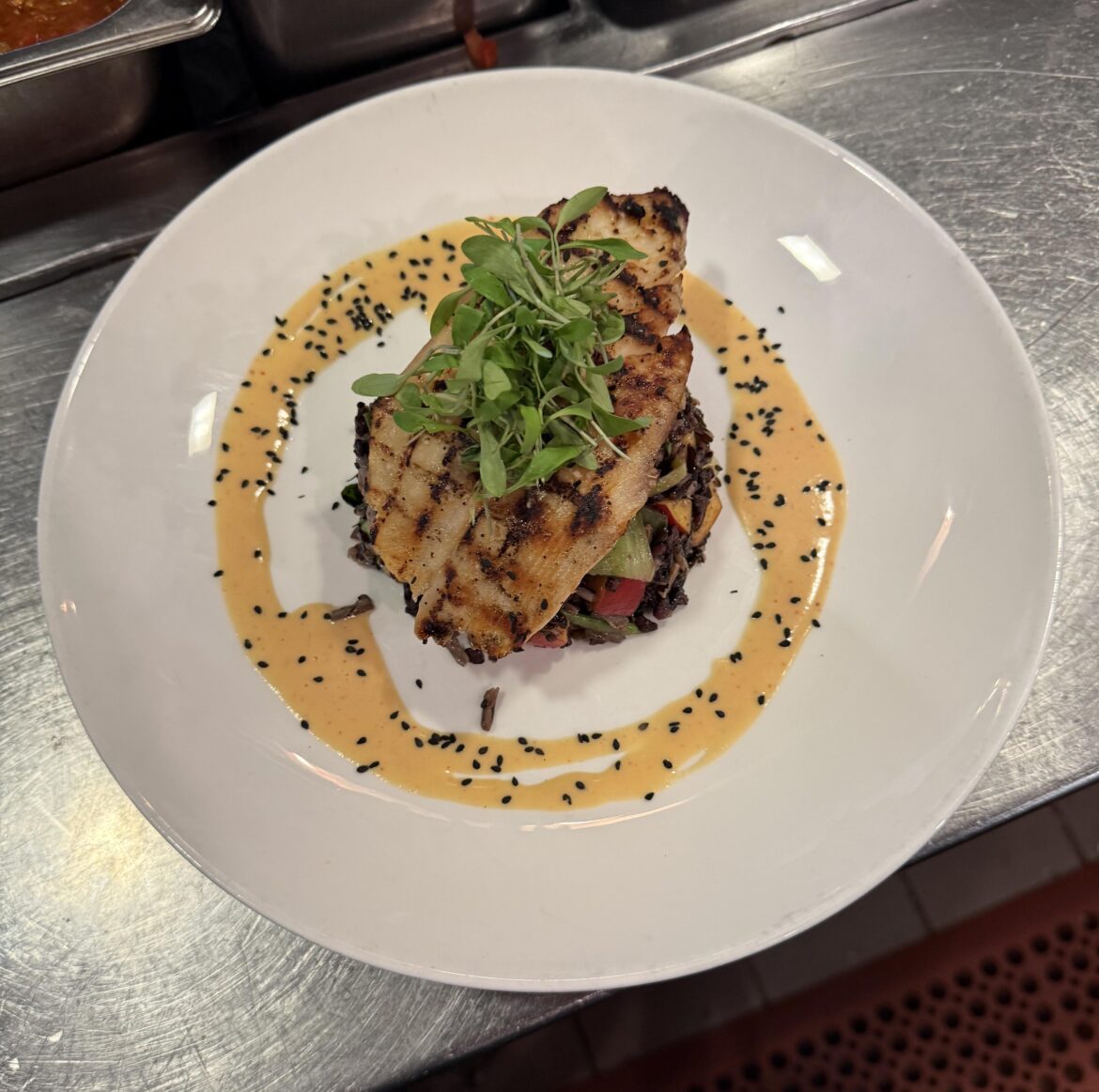 Grilled tamarind ono forbidden rice salad and a nectarine vinaigrette.