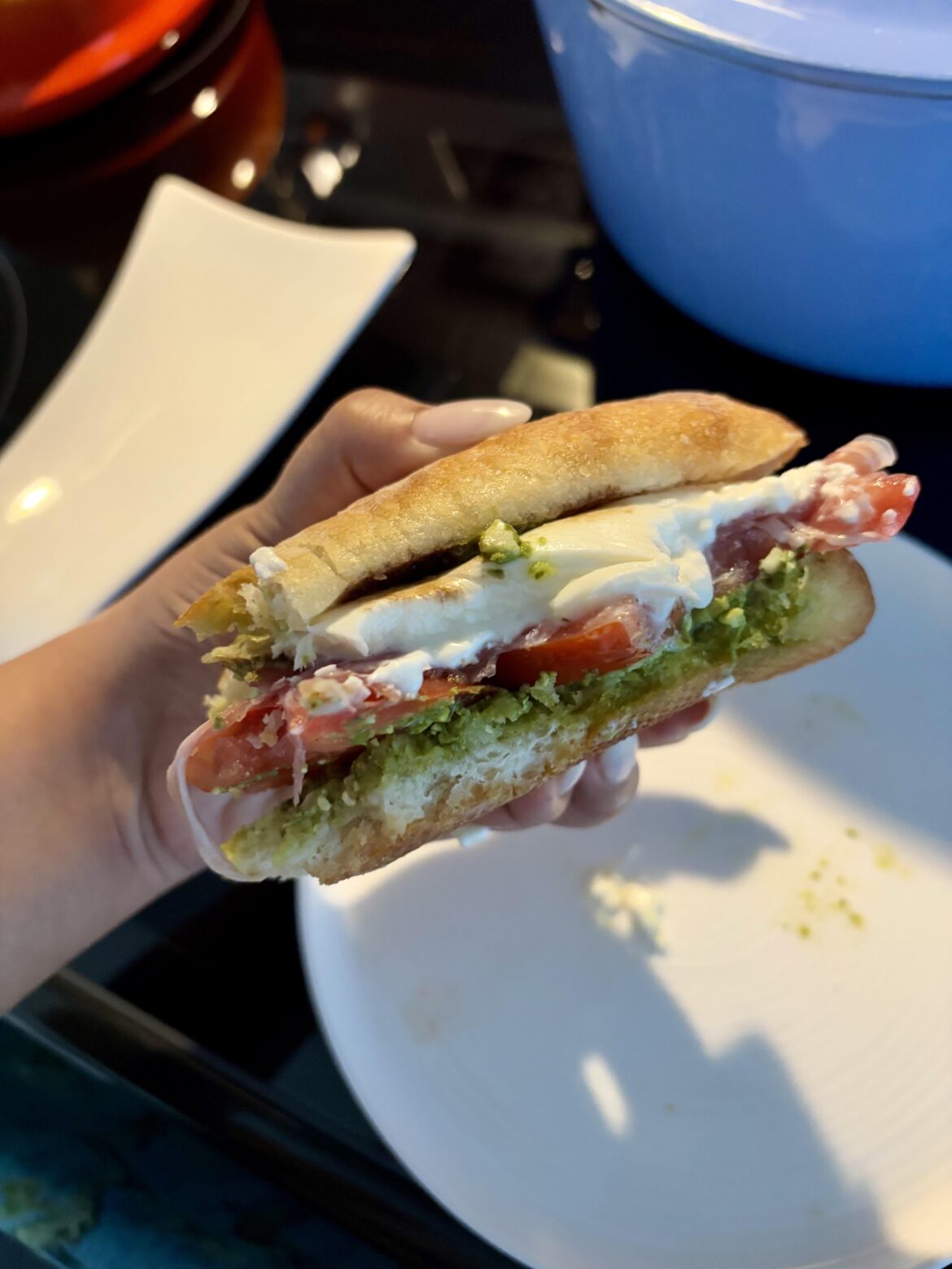 Pesto, burrata, heirloom tomato, prosciutto, balsamic sandwich! So good I had to get a couple bites in first lol. Also, thanks to this reddit and sandwiches, things feel brighter.